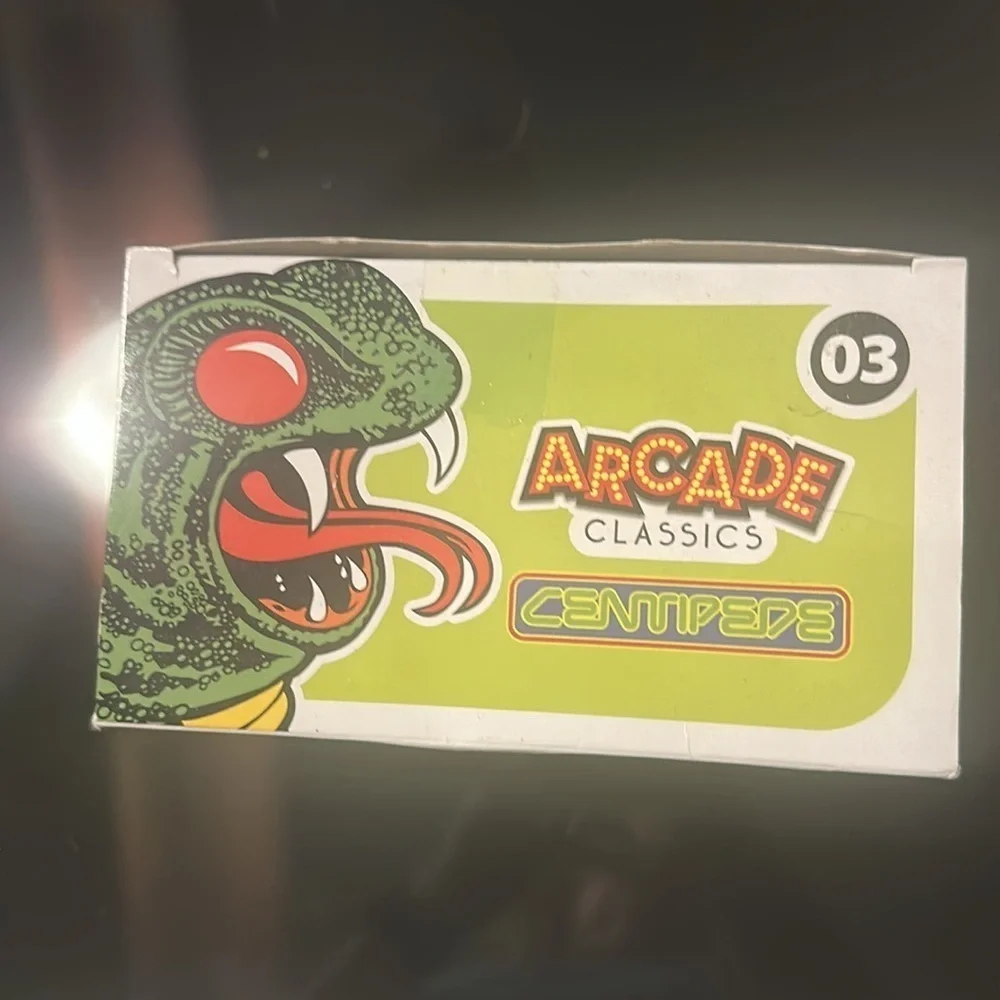 Arcade Classics Centipede hand held game.